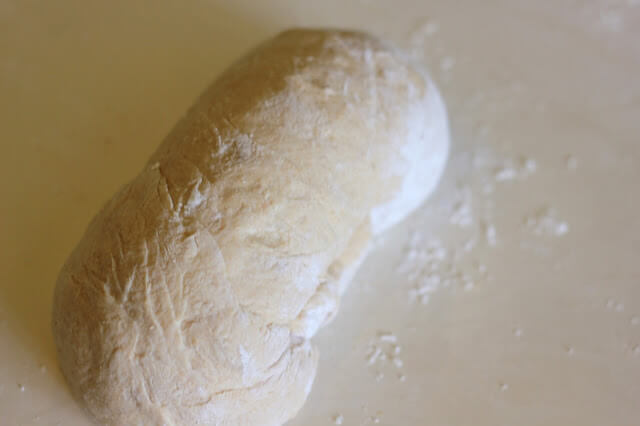 rolled bread dough with ends tucked under