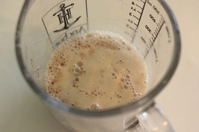 yeast reacting with other liquid ingredients in a glass measuring cups