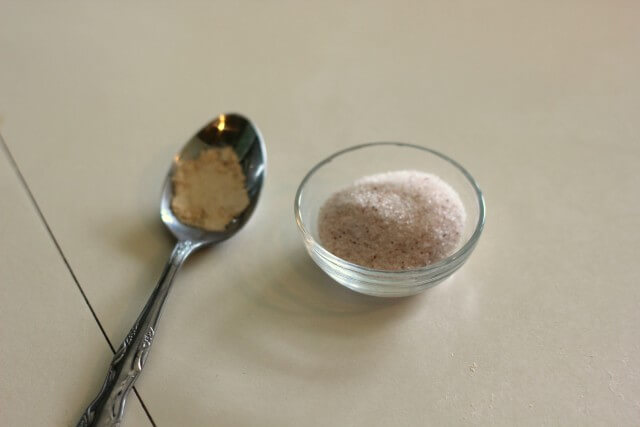 salt in a small book and ascorbic acid in a metal spoon