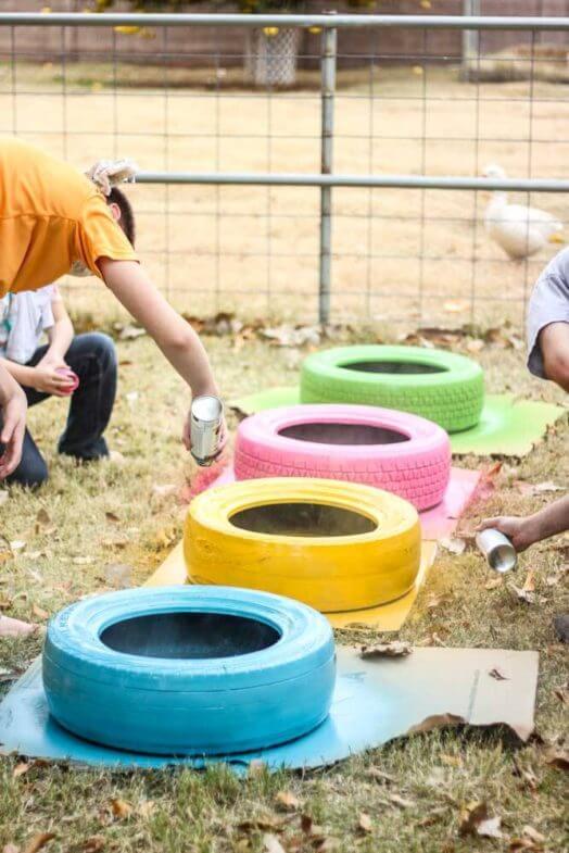 Kids spray painting tires outside