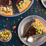 Plate with slice of shoofly pie with glaze and pistachios