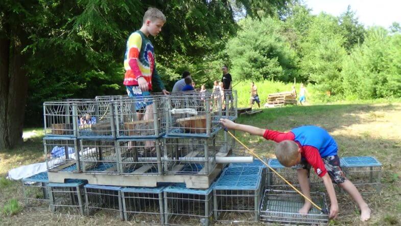 kids building with stacked milk crates