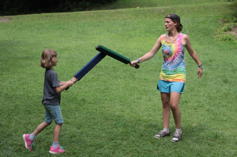 kids playing with foam swords