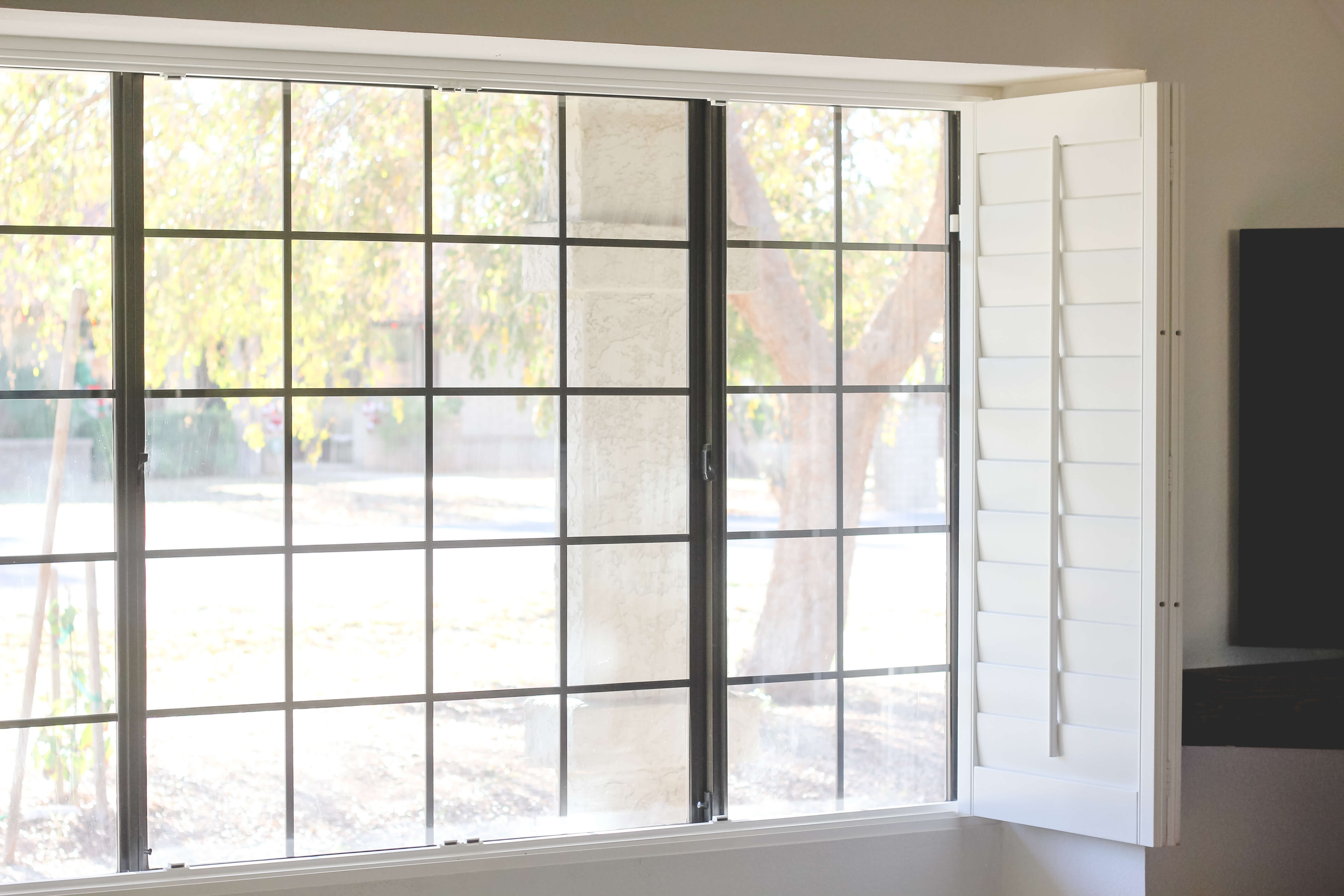 Plantation shutters in family room. 